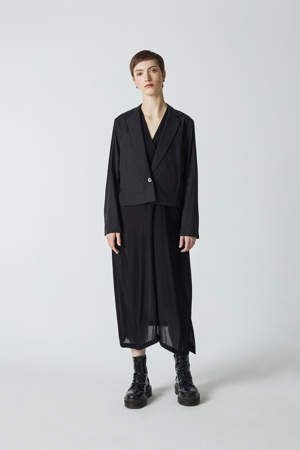 woman wearing handmade, original design, Japanese inspired, black cropped pleated jacket, in cotton cupro