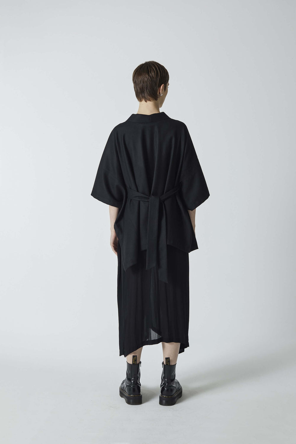 woman wearing a black, wool, designer clothing, Japanese inspired, butterfly kimono