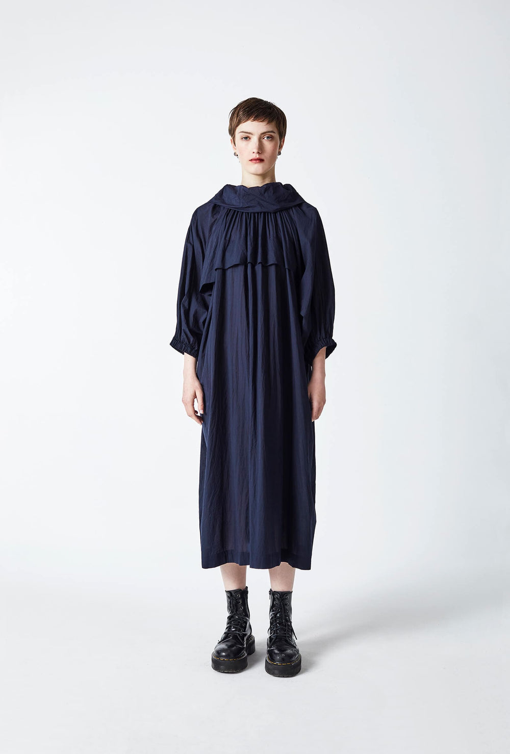 woman wearing a romantic, feminine,  navy, handmade, gathered , frilled, puffed sleeve maxi dress