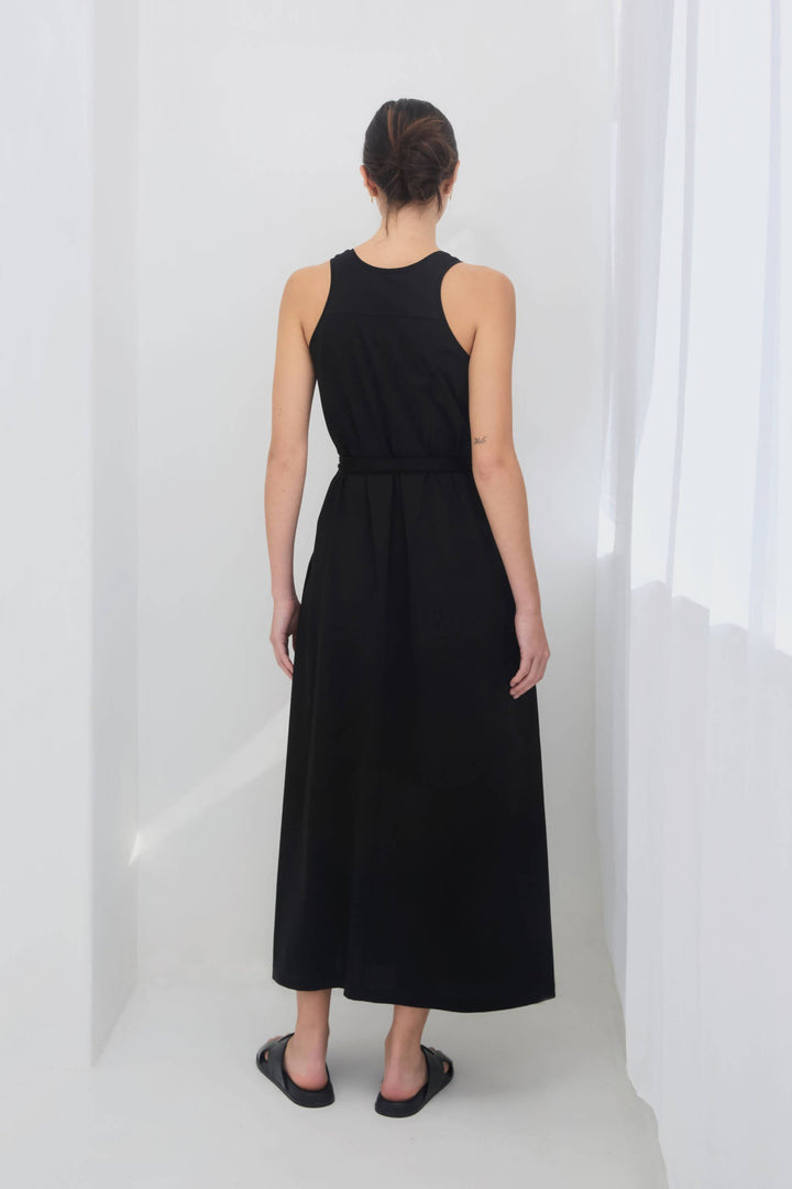 woman wearing a black sleeveless racer back singlet maxi dress