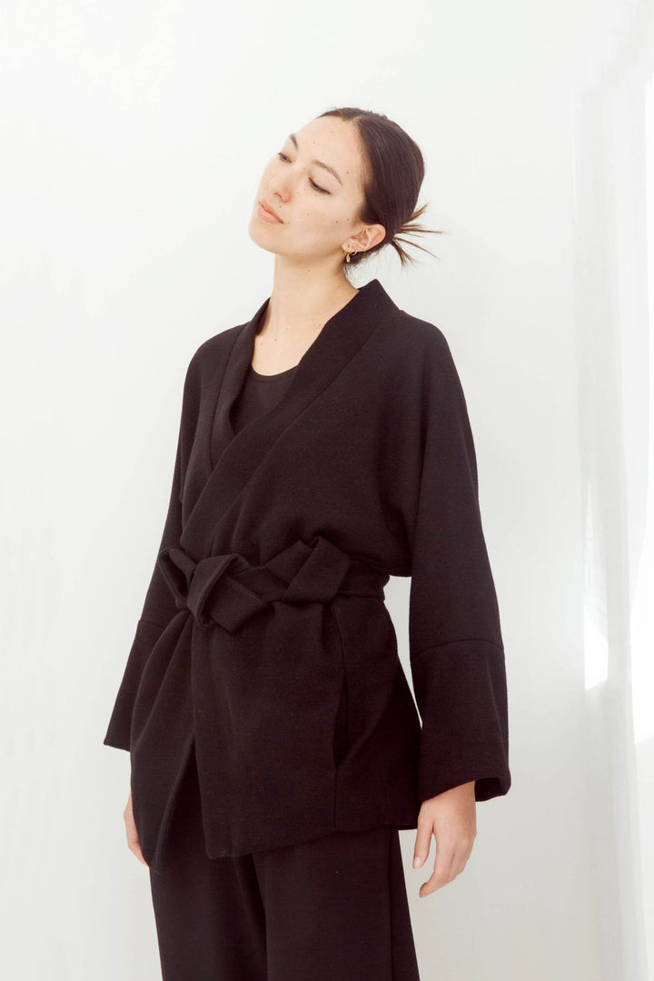 woman wearing a handmade black kimono with obi belt