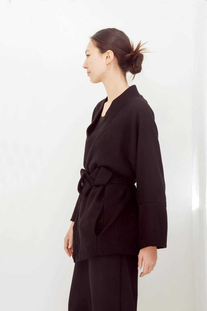 woman wearing a handmade black kimono with obi belt