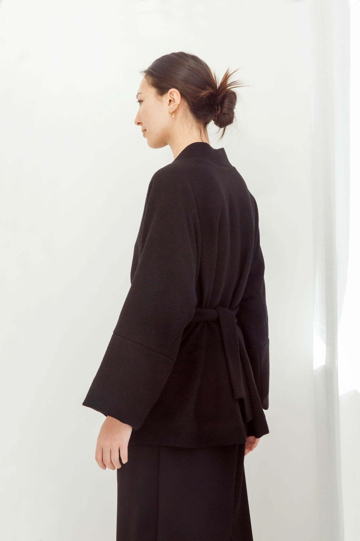 woman wearing a handmade black kimono with obi belt