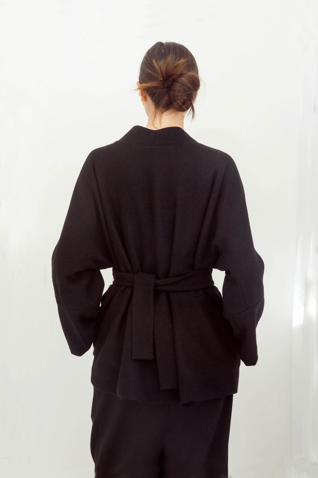 woman wearing a handmade black kimono with obi belt