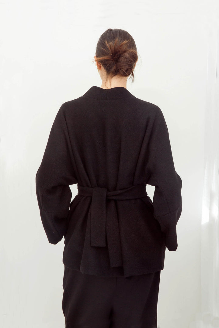 woman wearing a handmade black kimono with obi belt