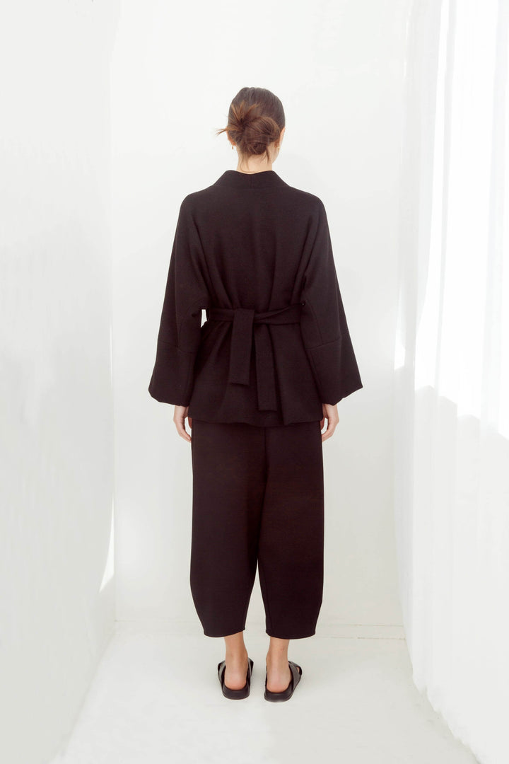 woman wearing a handmade black kimono with obi belt
