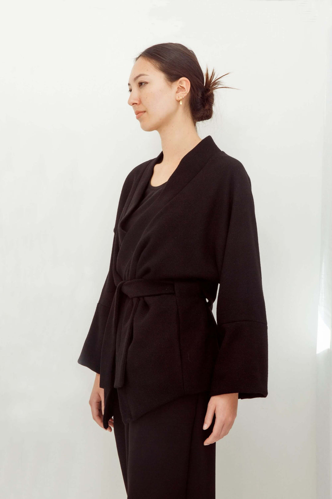 woman wearing a handmade black kimono with obi belt