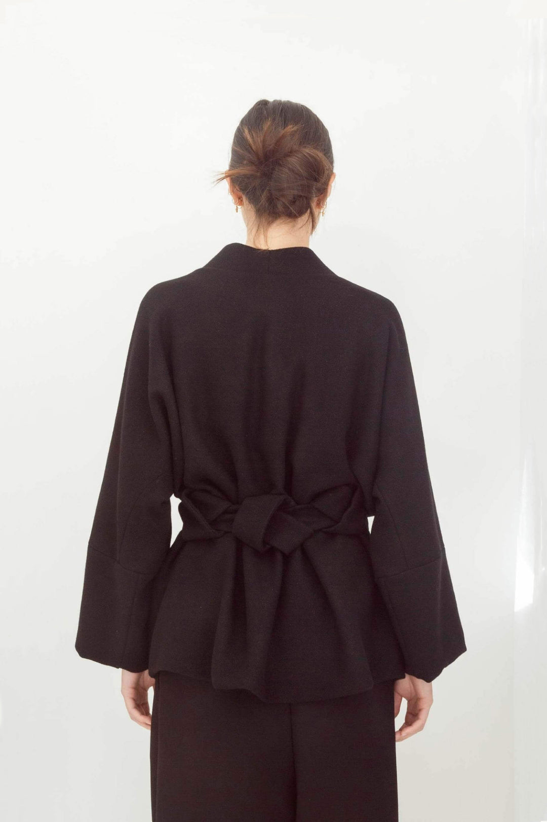 woman wearing a handmade black kimono with obi belt