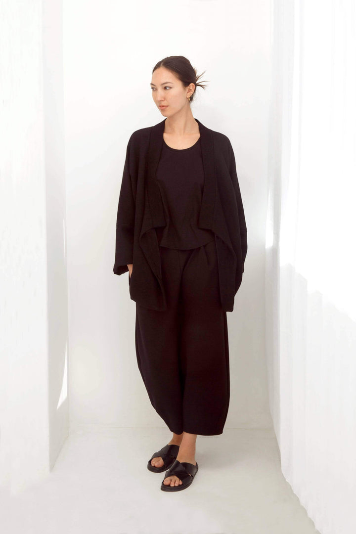 woman wearing a handmade black kimono with obi belt
