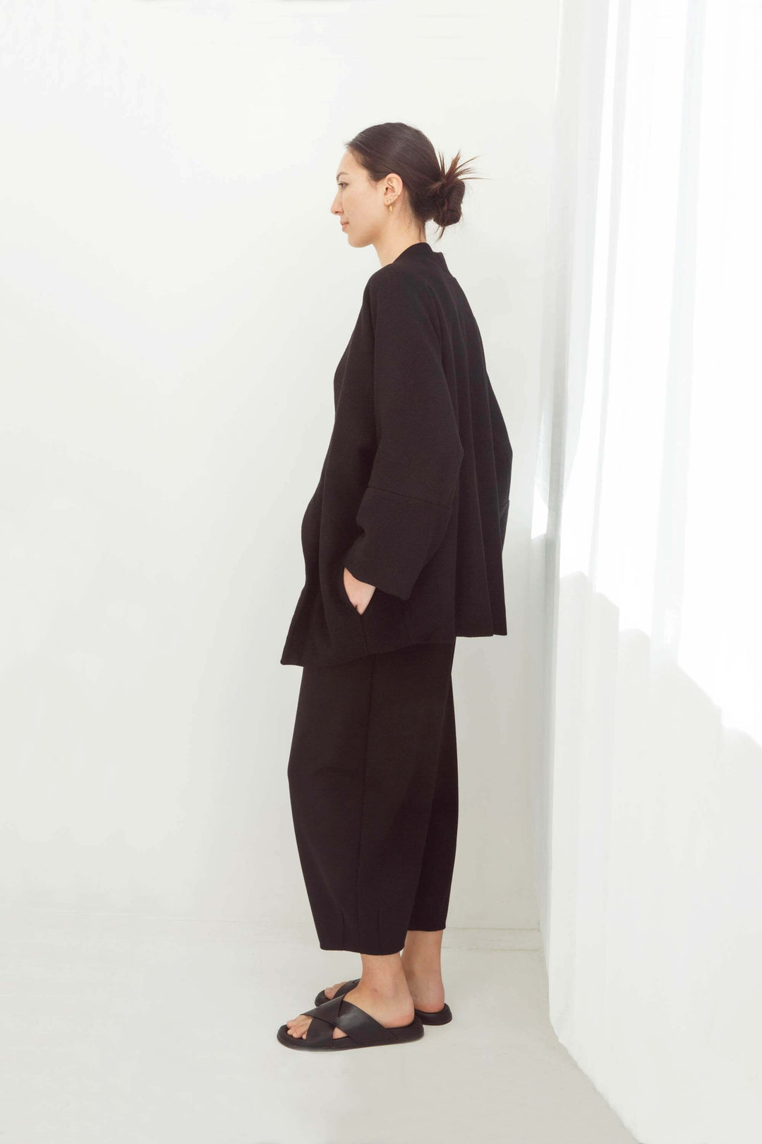 woman wearing a handmade black kimono with obi belt