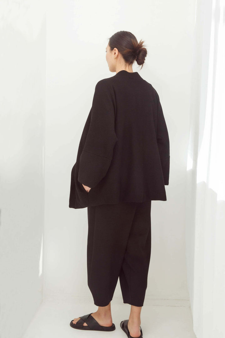 woman wearing a handmade black kimono with obi belt