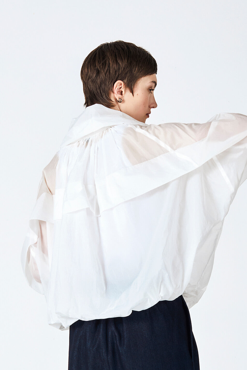 woman wearing white, handmade, original, Japanese inspired, gathered, frilled, oversize, outer layer, windbreaker top