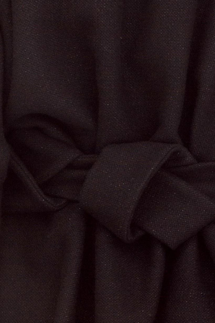 close up of black woollen jacket fabric